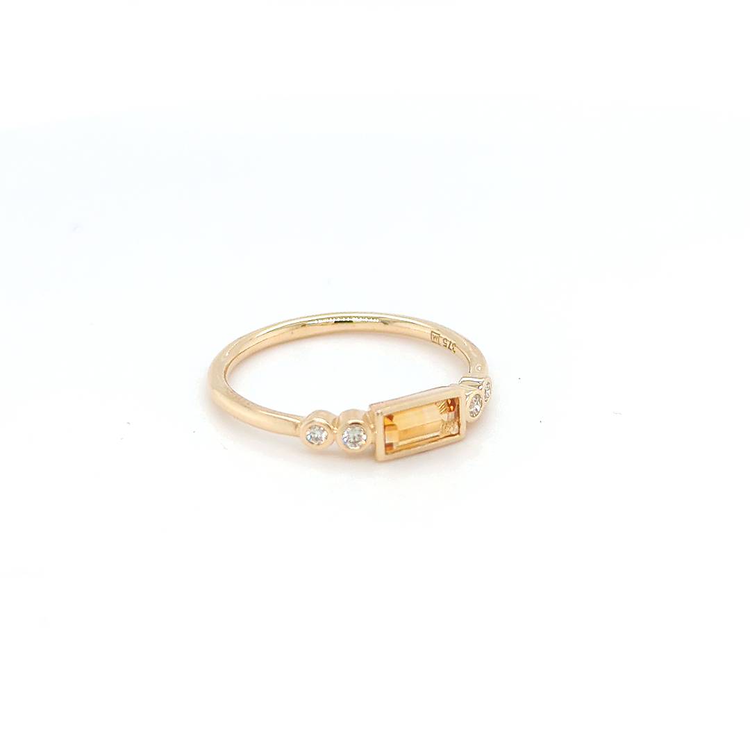 Image of 9ct Yellow Gold Ring featuring a 0.31ct Baguette Citrine and 4 Round Cut Natural Diamonds