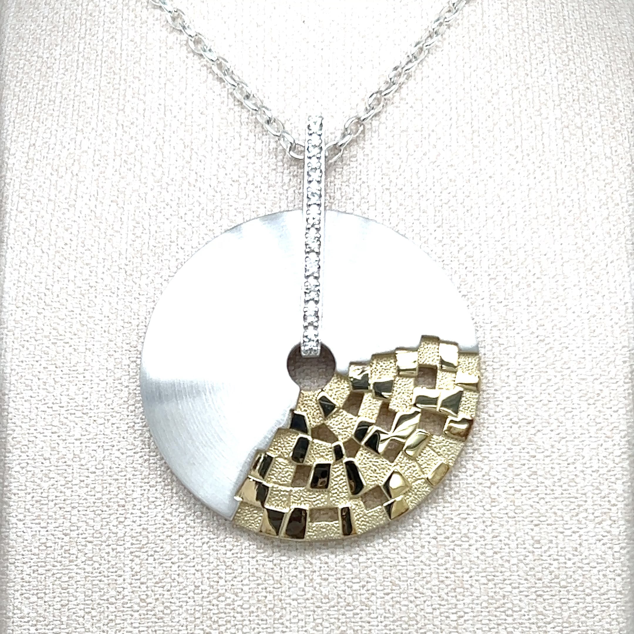 STERLING SILVER AND WHITE SAPPHIRE PENDANT