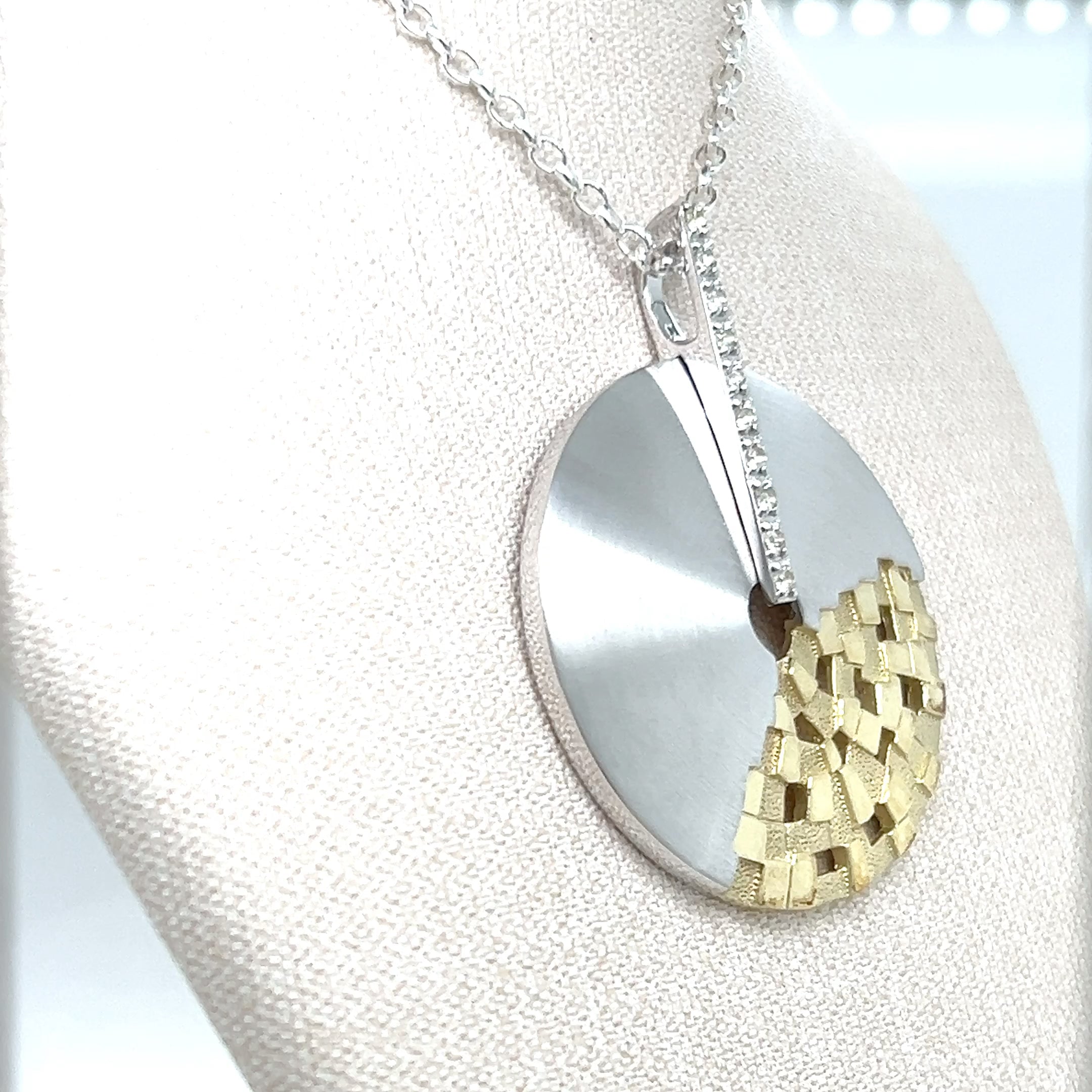 STERLING SILVER AND WHITE SAPPHIRE PENDANT