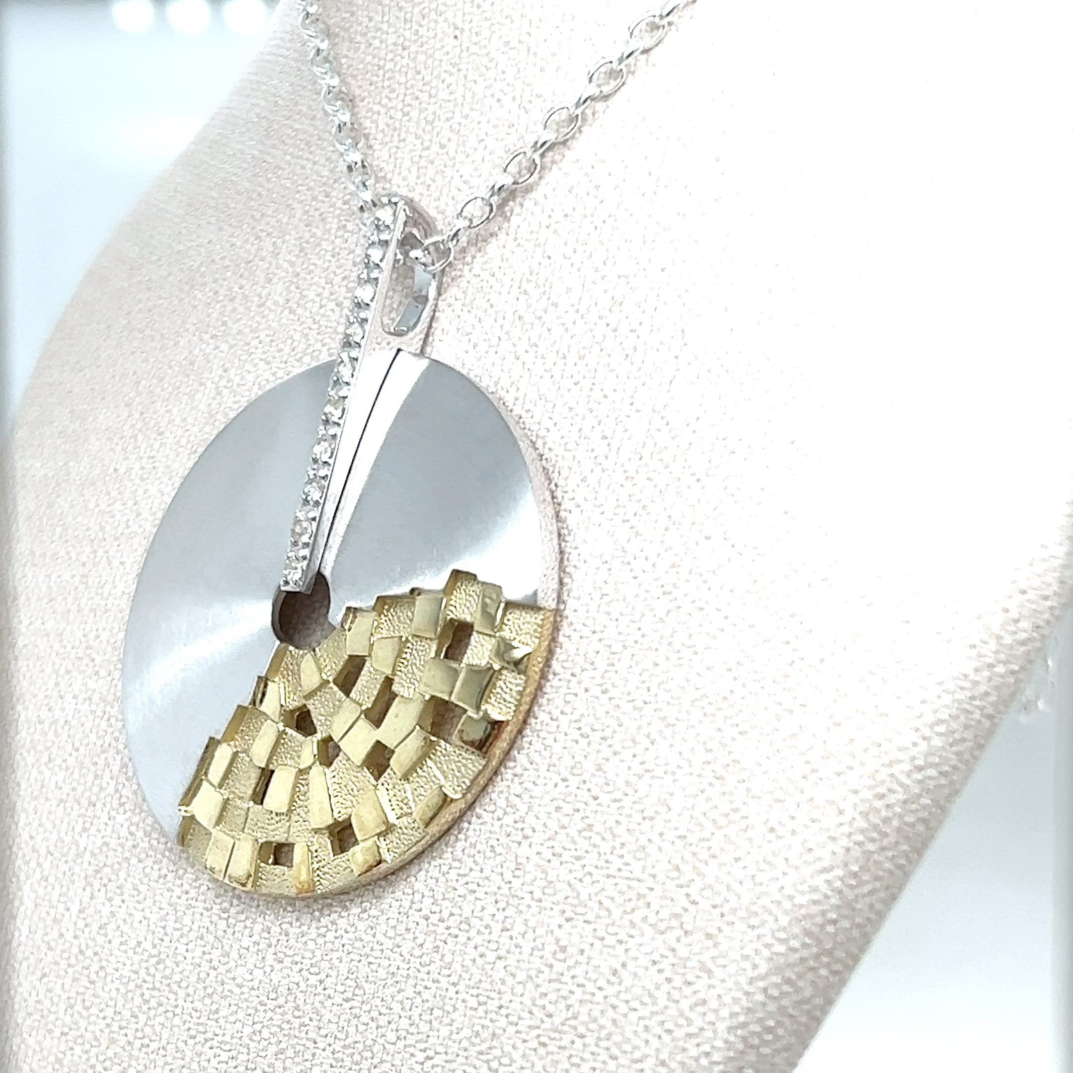 STERLING SILVER AND WHITE SAPPHIRE PENDANT