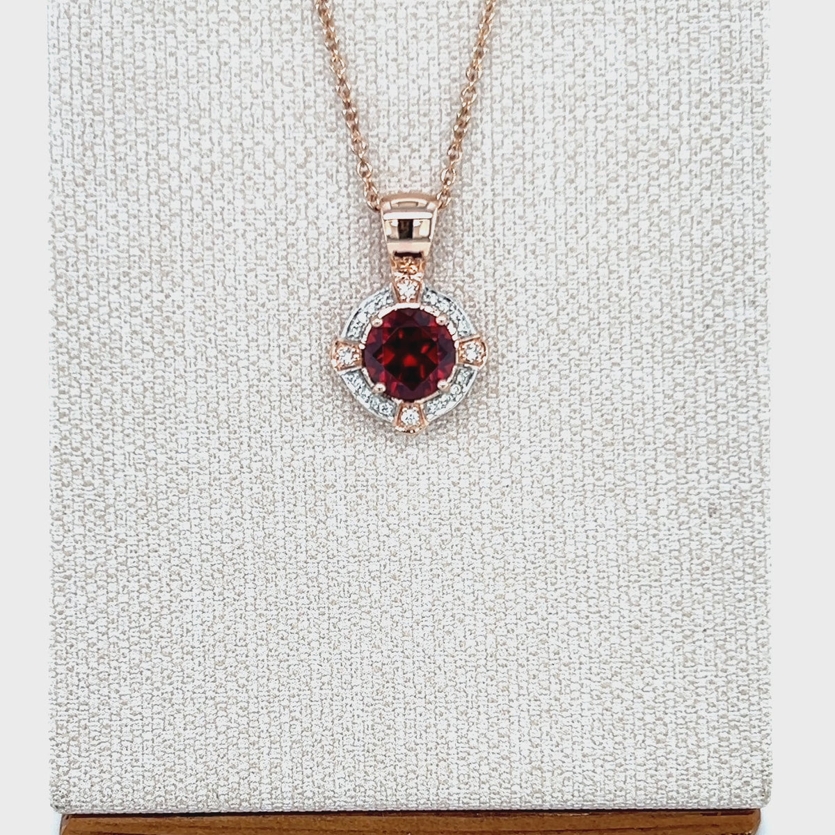 Load video: 9ct Rose Gold Garnet and Diamond Pendant