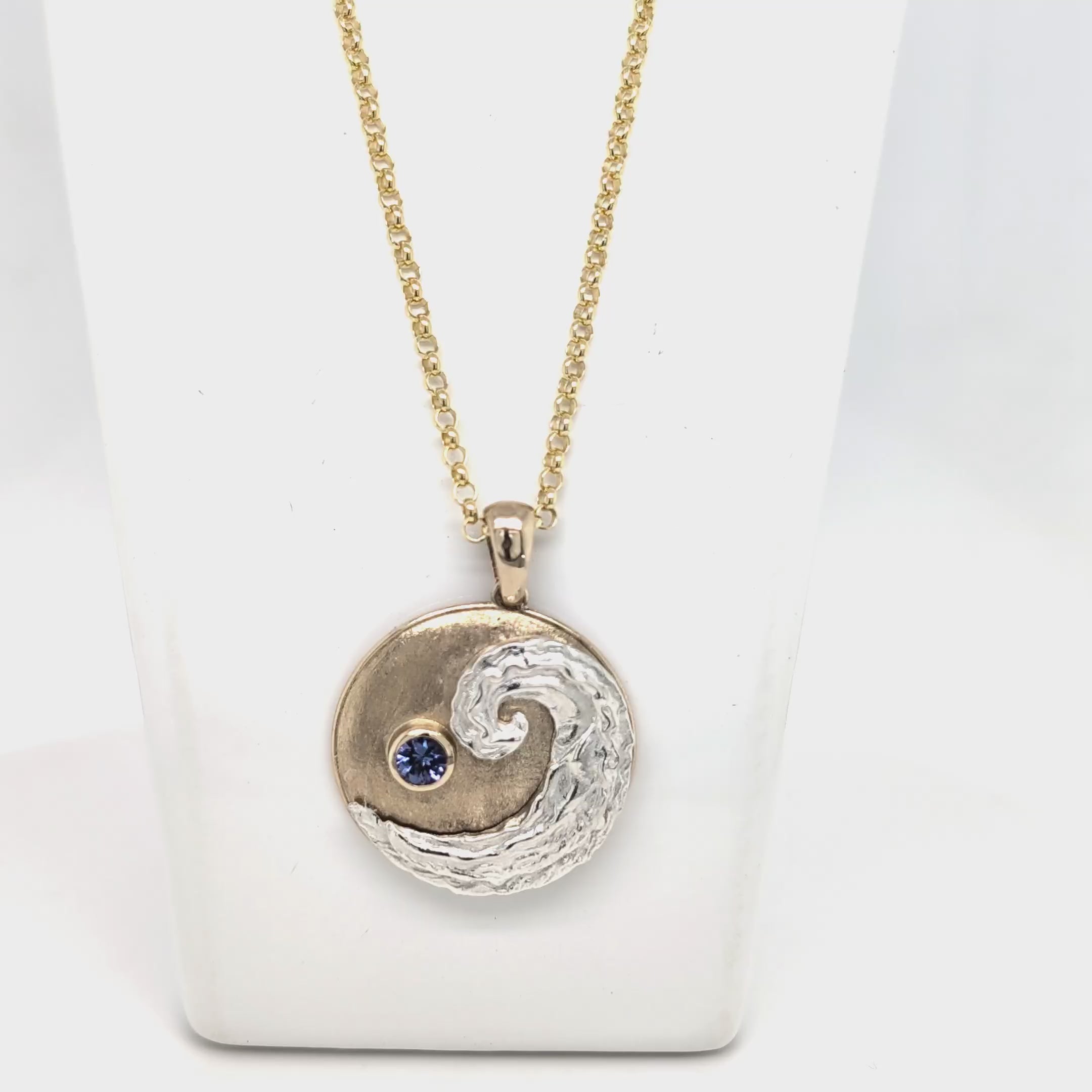 Ocean Wave pendant with 9ct Yellow gold and Silver with round Blue Tanzanite