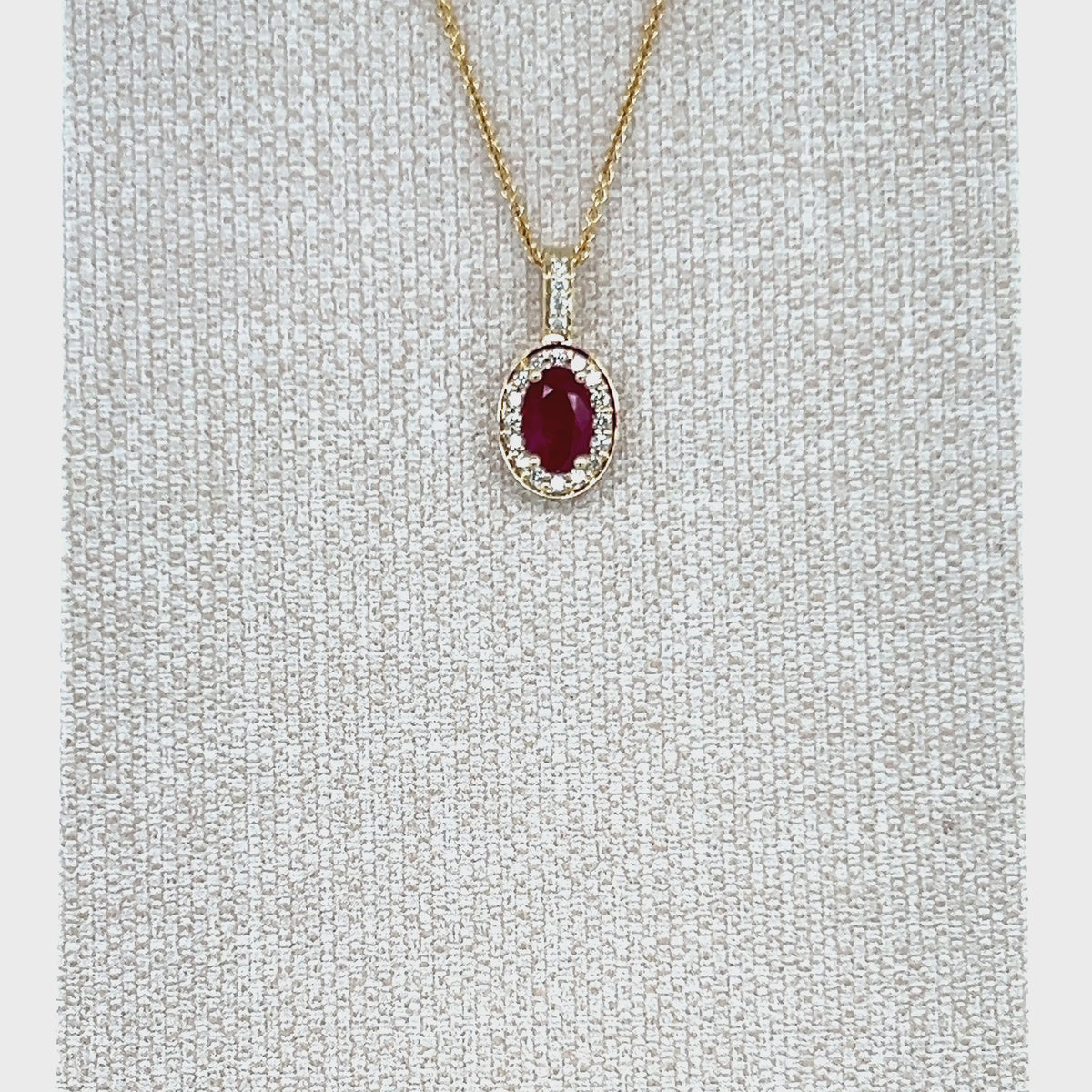 Load video: 9ct Yellow Gold Oval Ruby and Diamond Pendant